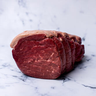 chopped topside beef on marble background 