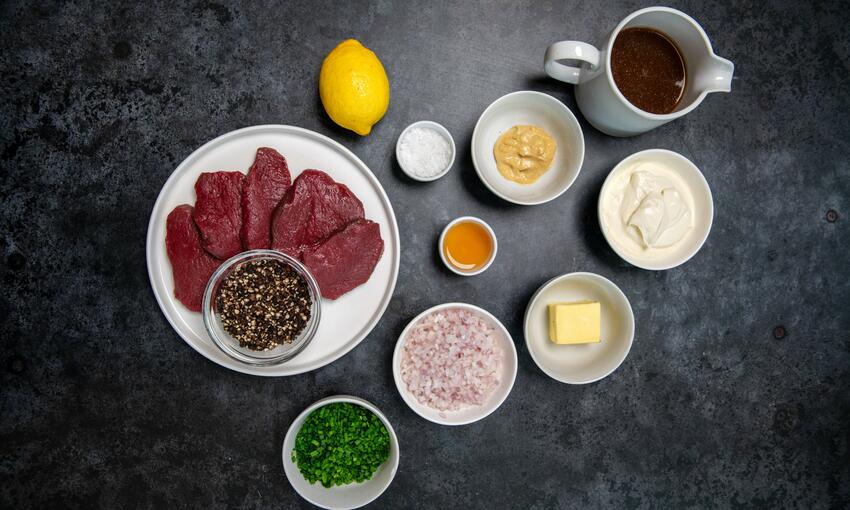 wild venison with raw ingredients prepared to cook  