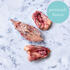 frozen chicken bones on marble background 