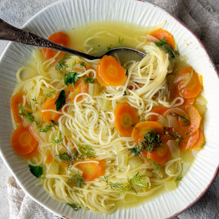 chicken noodle soup with veggies in bowl