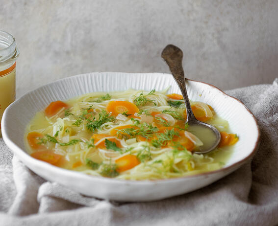 cooked chicken noodles in soup 