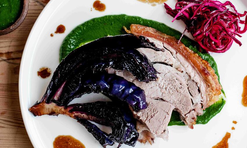 roasted pork shoulder with roasted red cabbage and green sauce