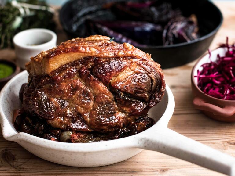 roasted pork shoulder with roasted red cabbage and green sauce