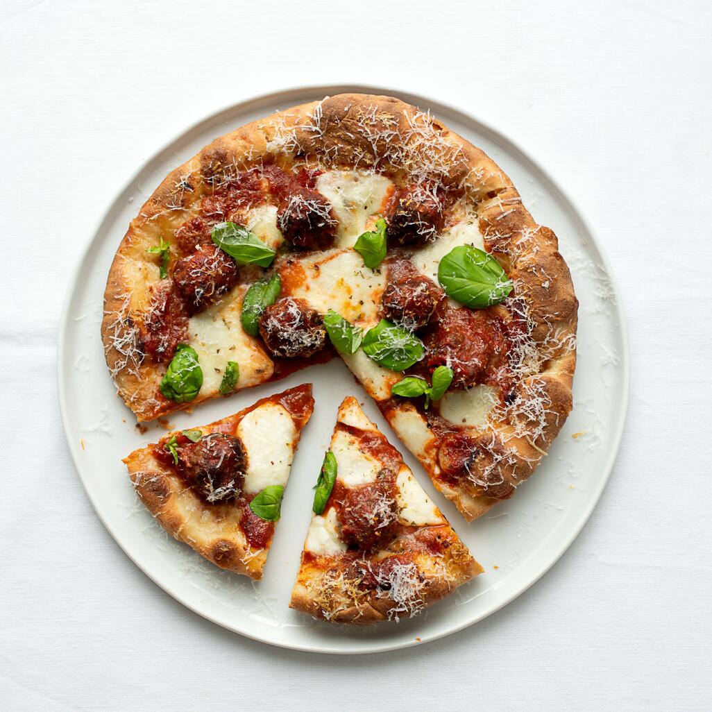 pizza cooked with beef and pork meatballs 