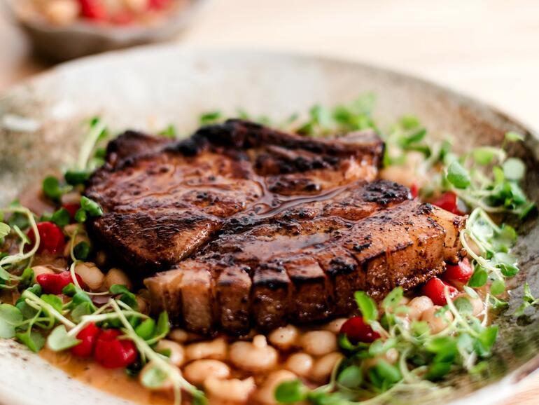 pork chops cooked in chilli butter with white beans