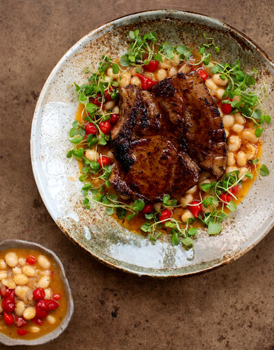 cooked pork chops in chilli butter with white beans