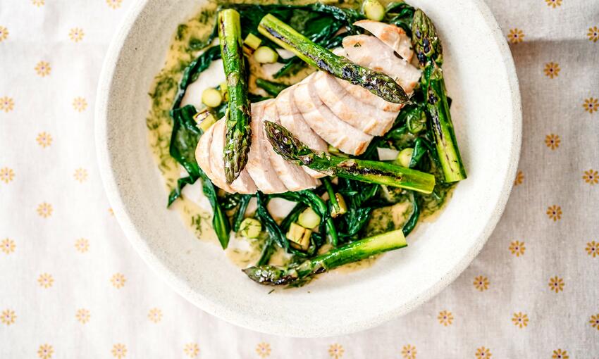 cooked butter chicken with asparagus and wild garlic