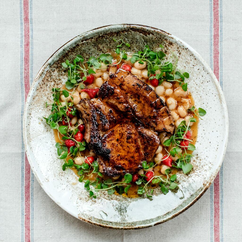 pork chop cooked with cooked butter and beans 