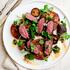 hanger steak with mild chimichurri sauce and burnt tomatoes 