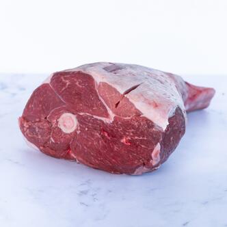 half leg of lamb on marble background