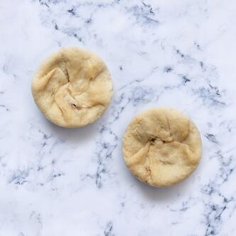 mutton & swede suet pudding on marble background