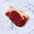 thick cut sirloin steak on marble background 