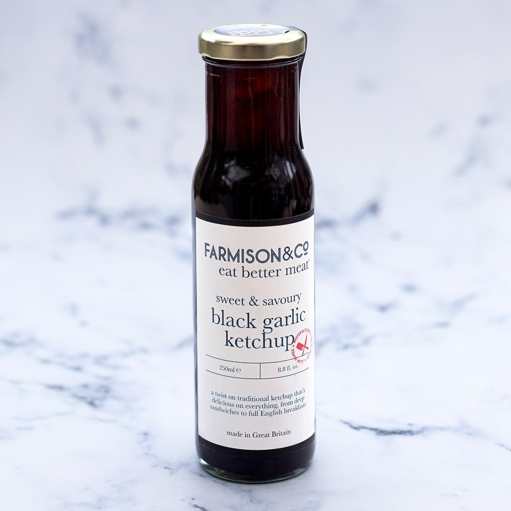 f&co black garlic ketchup on marble background