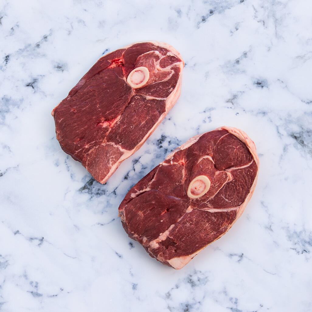 lamb gigot steak on marble background