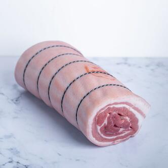 belly pork rolled on marble background