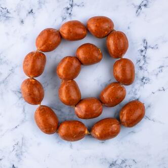 sweet cooking chorizo on marble background