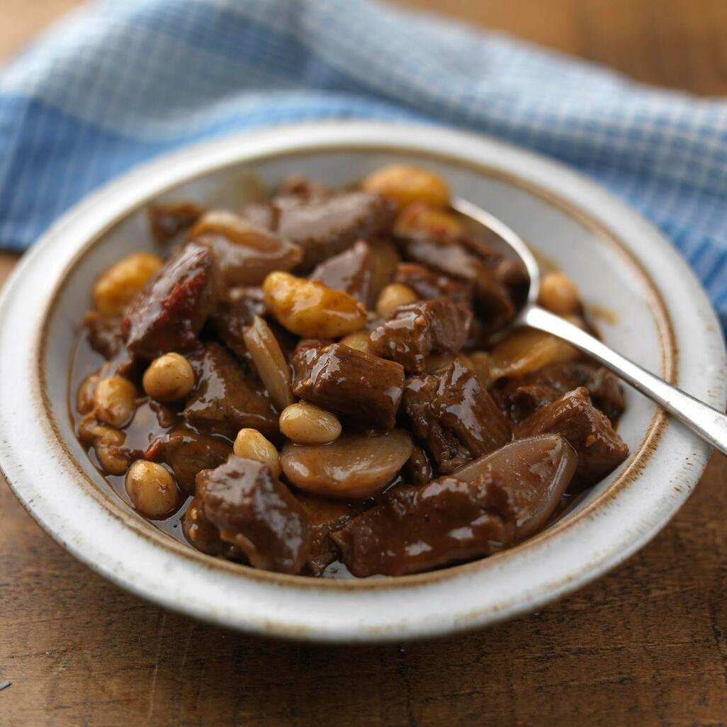 diced lamb cooked in curry with corn 