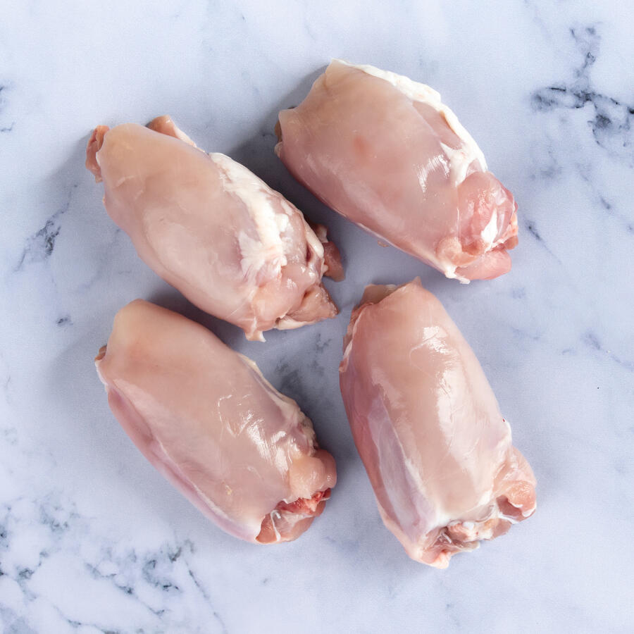 chicken thighs on marble background