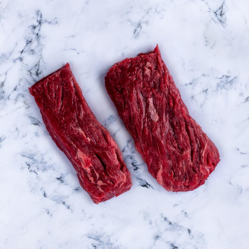 bavette steak on marble background