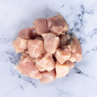 diced chicken breast on marble background 