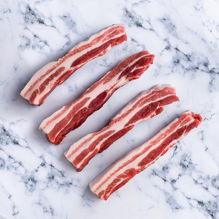 pork belly steak on marble background