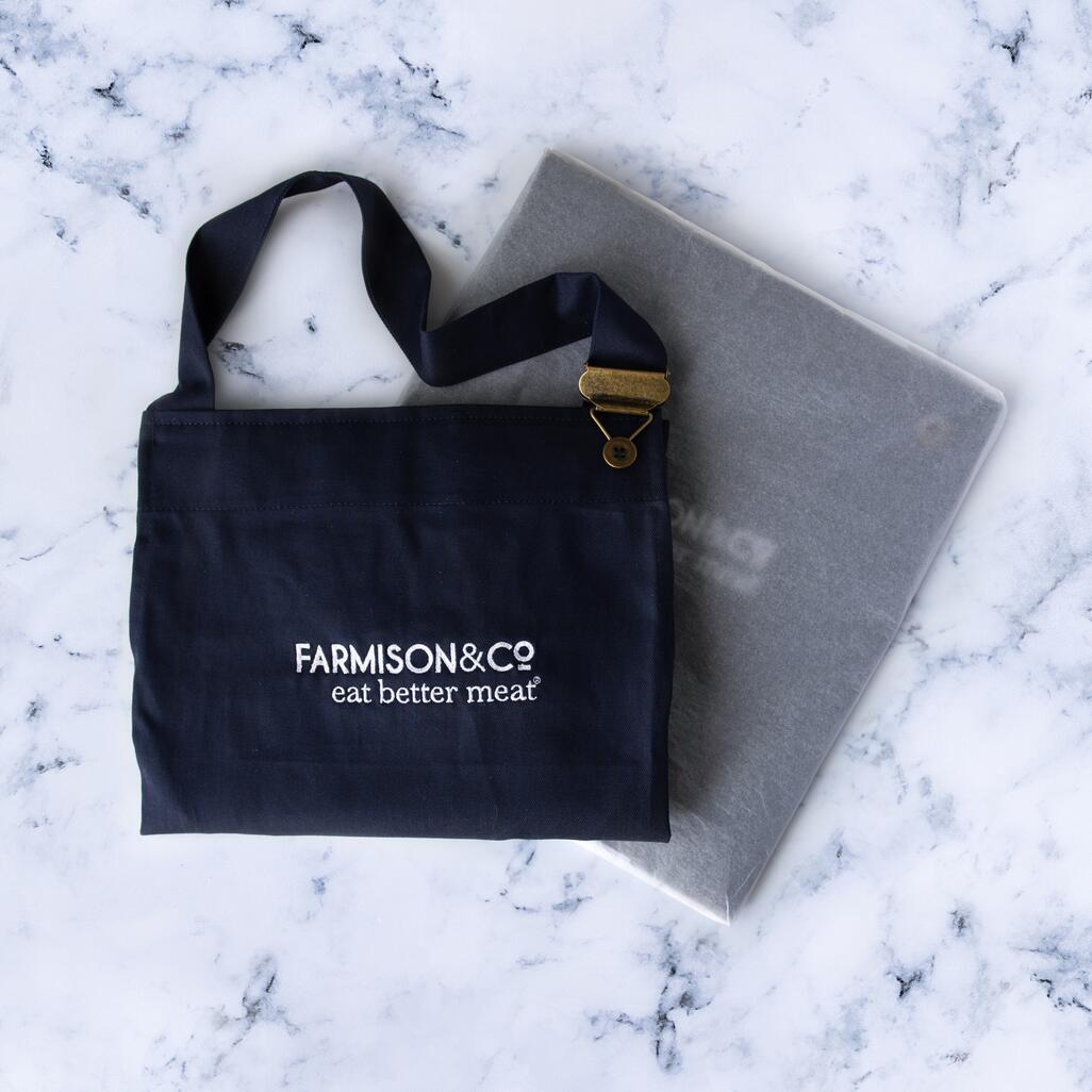 f&co butcher's apron on marble background