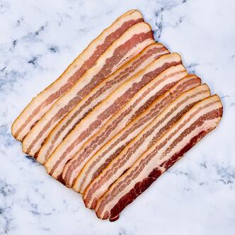 streaky bacon smoked on marble background