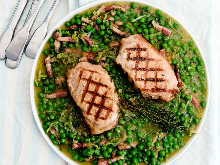 cooked pork loin steak with peas a la françoise