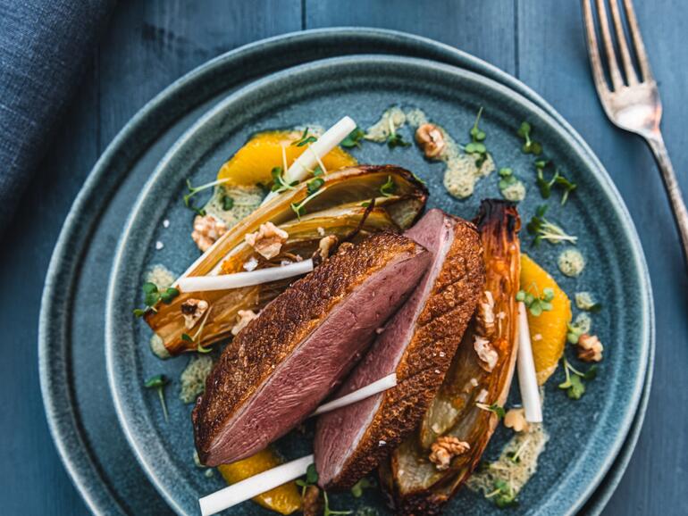 roasted duck steak with chicory & walnut vinaigrette