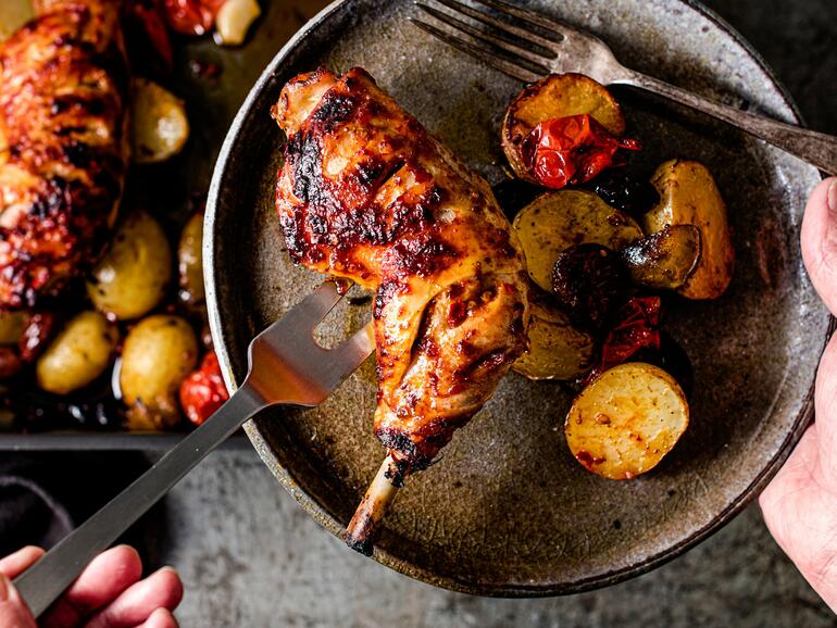 cooked chicken traybake with harissa, olives & potatoes