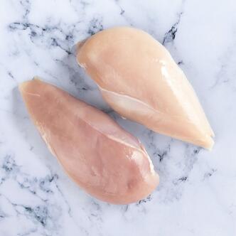 chicken breasts on marble background