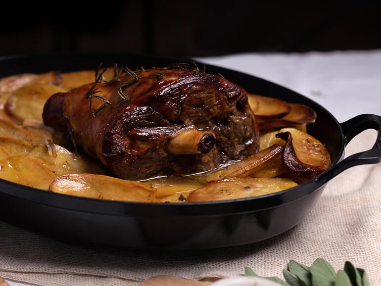 cooked slow roast lamb on boulangère potatoes