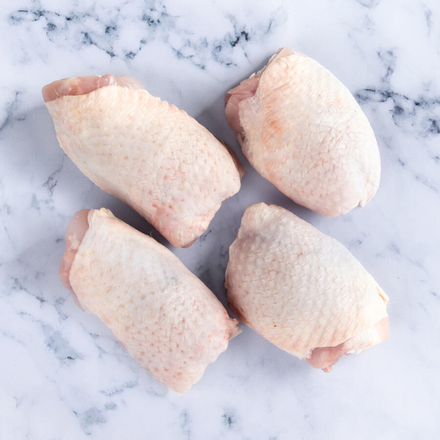 chicken thighs on marble background