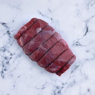 haunch joint of venison on marble background