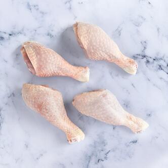 chicken drumsticks on marble background