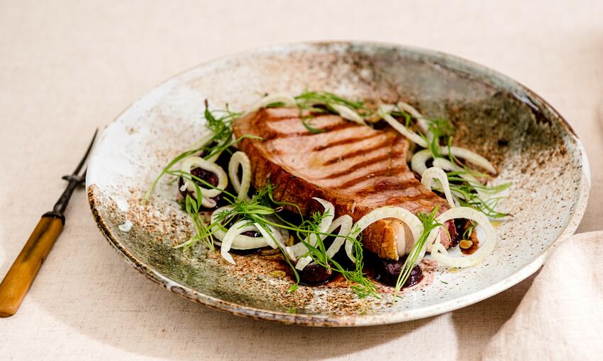 grilled pork chop with sweet pickled cherries