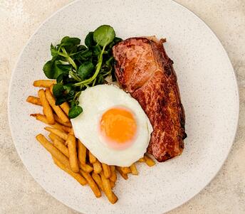 cooked gammon steak, fried egg & chips