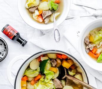 cooked lamb broth with aromatic roots