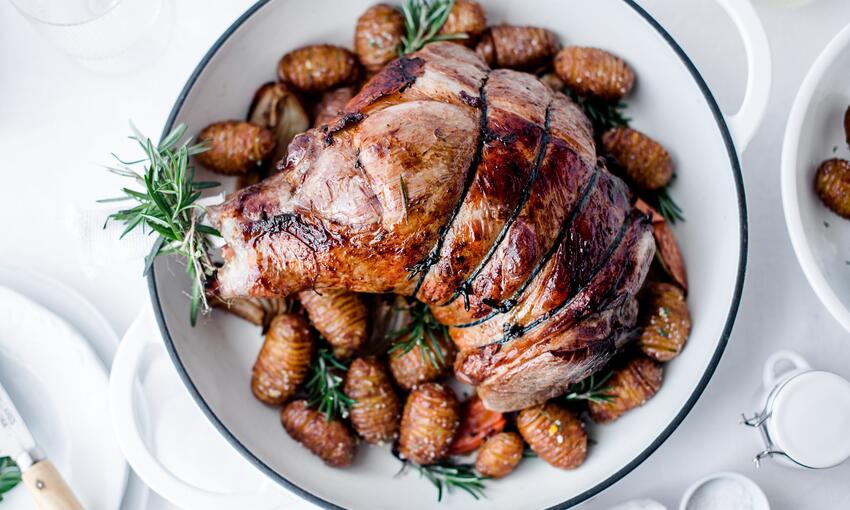 cooked hasselback potatoes with schmaltz and rosemary