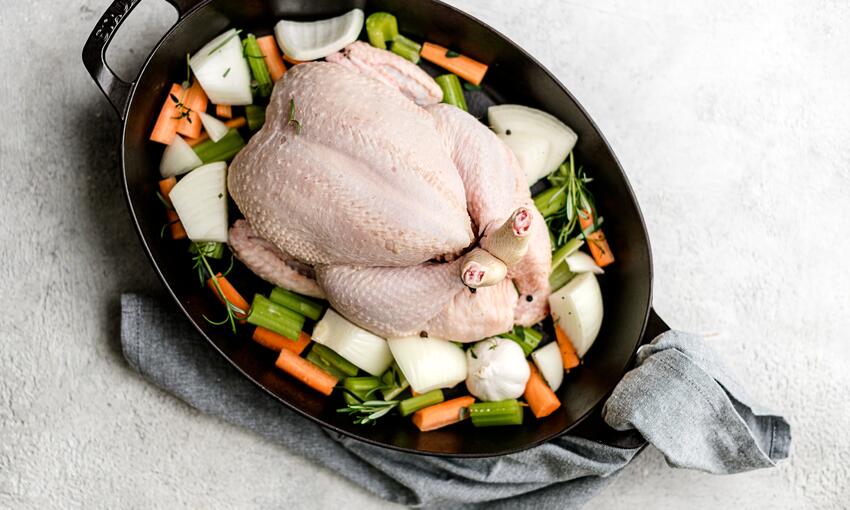 roast chicken and its ingredients in cooking tray 