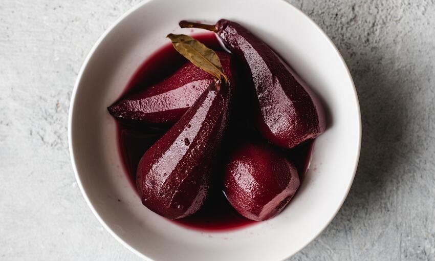 spiced pears and red wine in a bowl