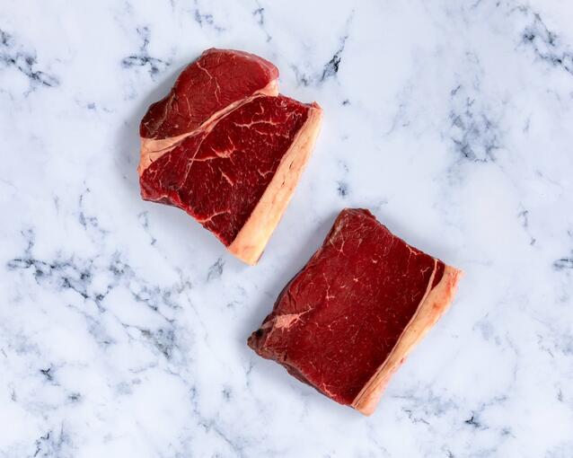 raw rump steak on marble 