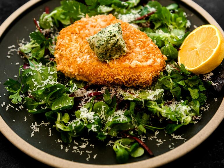 breaded pork cutlet with herb butter 