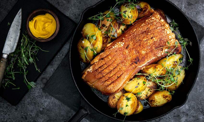 cooked pork belly confit with roast potatoes 