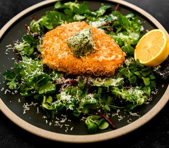 breaded pork cutlet with herb butter 