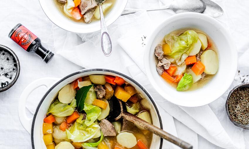 cooked lamb broth with aromatic roots