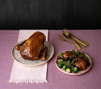 duck crown & stuffed legs with dark fruits, smoked pancetta & juniper cooked