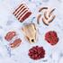 essential meat box displayed on marble background 