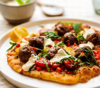 lamb kofta flatbreads with heritage tomatoes 