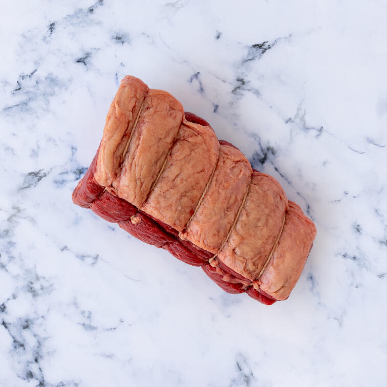 chopped topside beef on marble background 